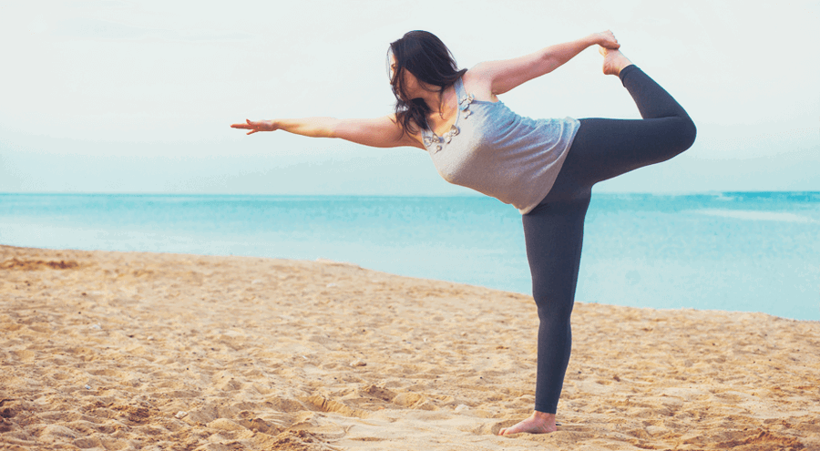 body positive woman doing yoga pose